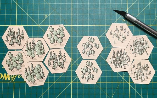 Hand-drawn forest hex tiles from a board game prototype